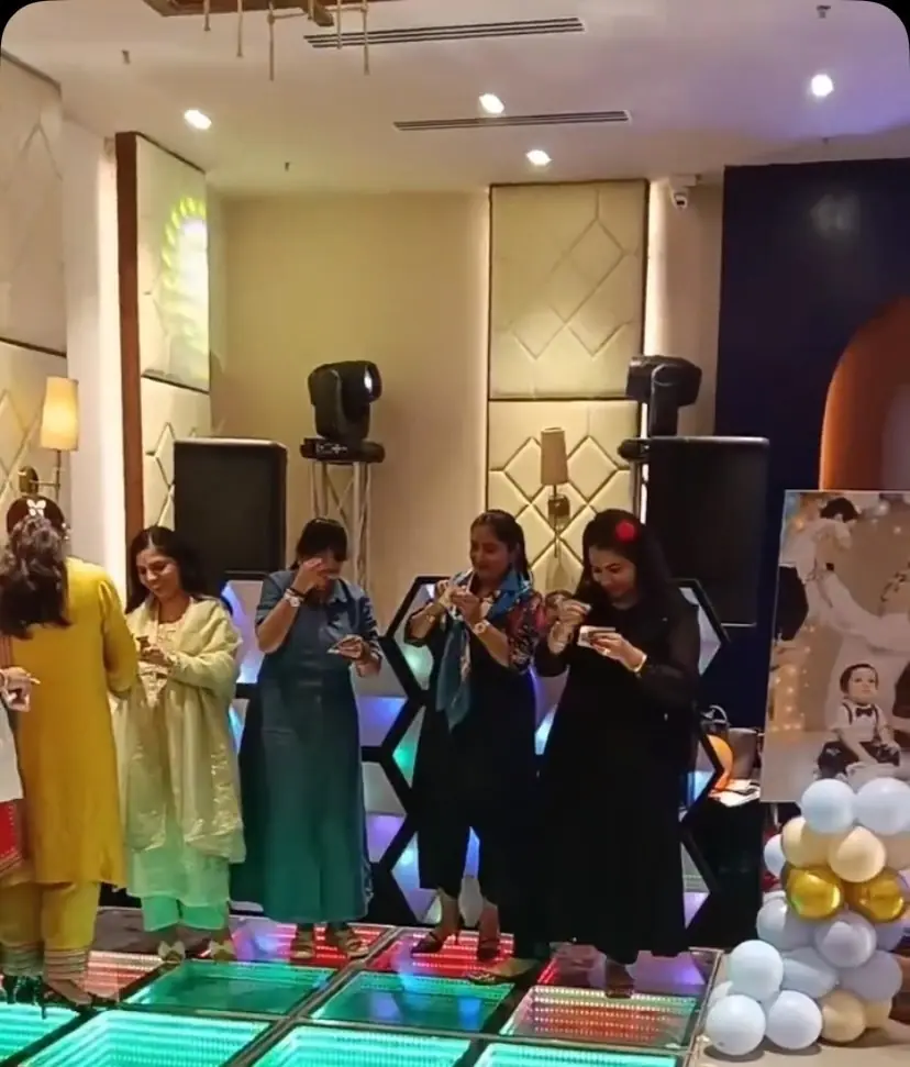 Guests playing a game on the dance floor at a birthday party hosted by Anu Manocha