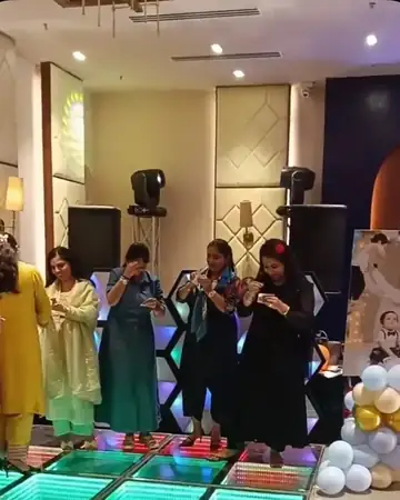 Guests playing a game on the dance floor at a birthday party hosted by Anu Manocha