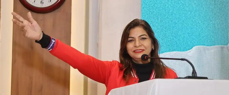 Anu Manocha at the lectern during a VBG business meet