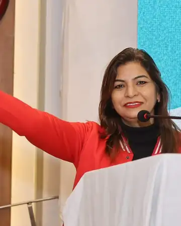 Anu Manocha at the lectern during a VBG business meet