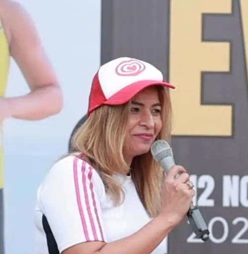 Anu Manocha in a cap hosting a marathon event, November 2024