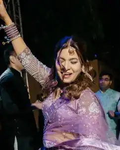 Anu Manocha dancing with guests at a mehndi night