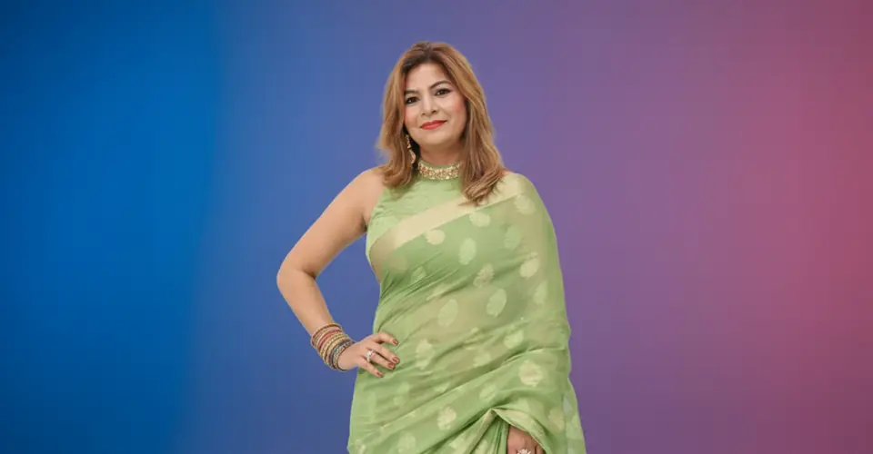 Portrait of Anchor Anu Manocha in a green saree
