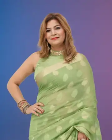 Portrait of Anchor Anu Manocha in a green saree