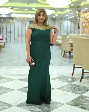 Anu Manocha in a green gown, full-length portrait