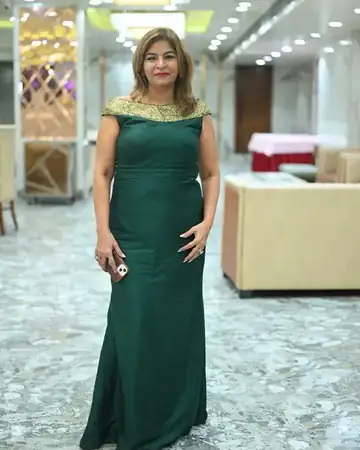 Anu Manocha in a green gown at a banquet venue