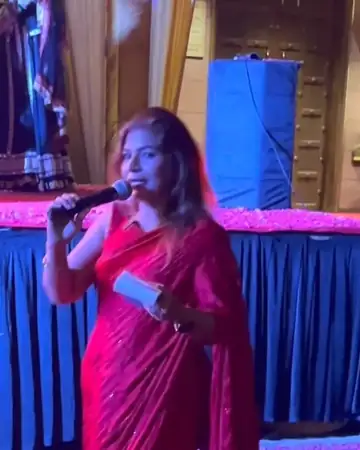 Anu Manocha in a red saree hosting a restaurant opening night
