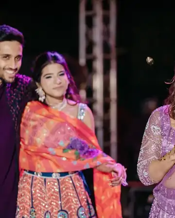 Anu Manocha reading out a message for the couple at a sangeet night