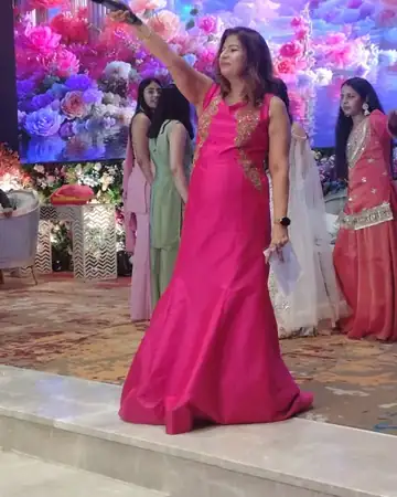 Anu Manocha hosting a sangeet with the bride's friends behind her