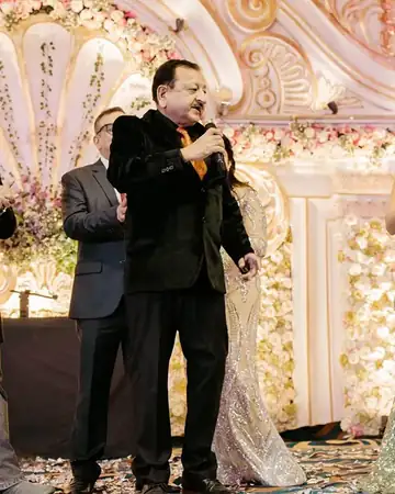 Anu Manocha bringing elders onto the stage at a wedding function
